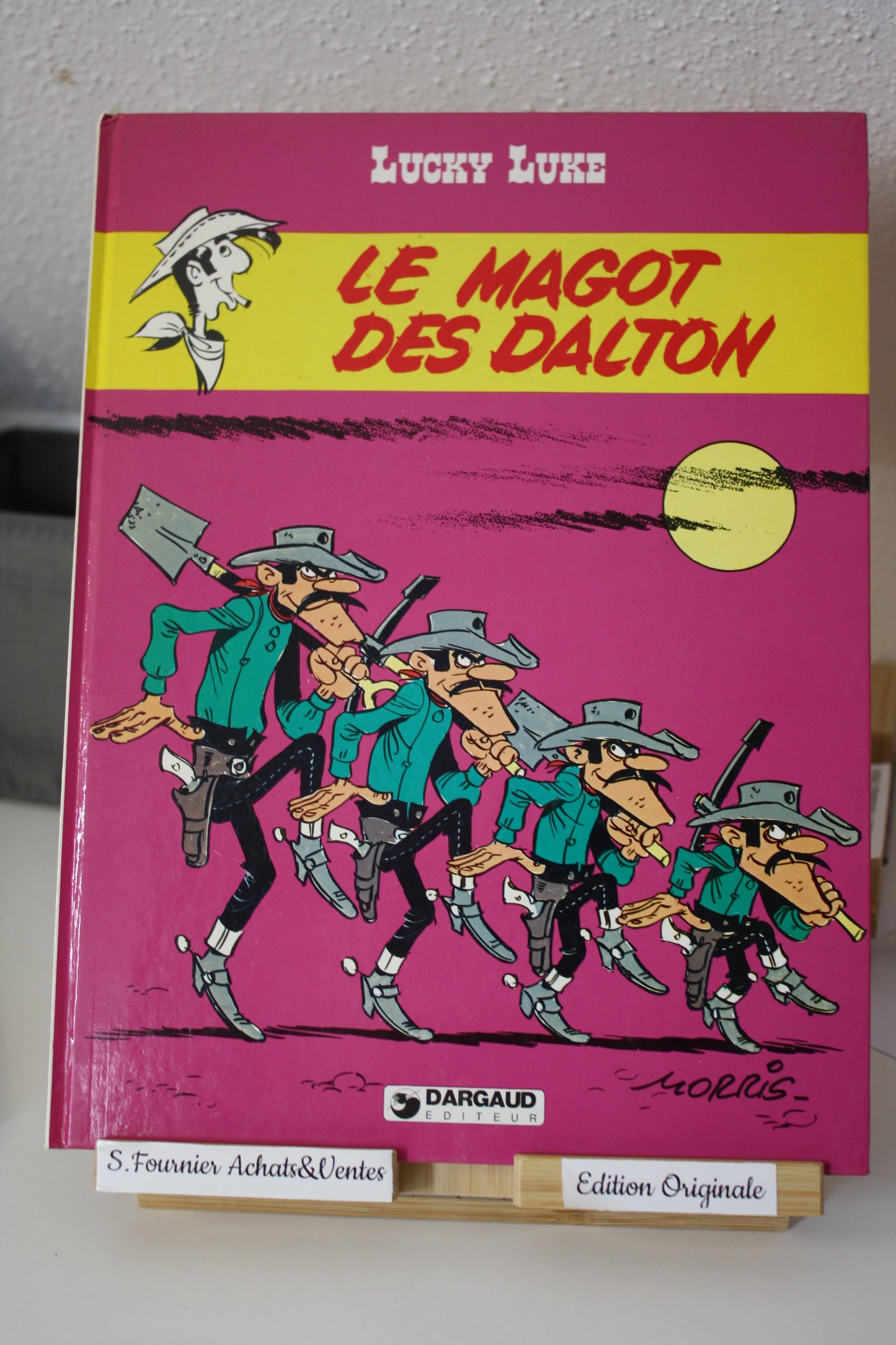 Le magot des Dalton – Lucky Luke – Morris - Dargaud Editeur - EO – 1987 - Abimé