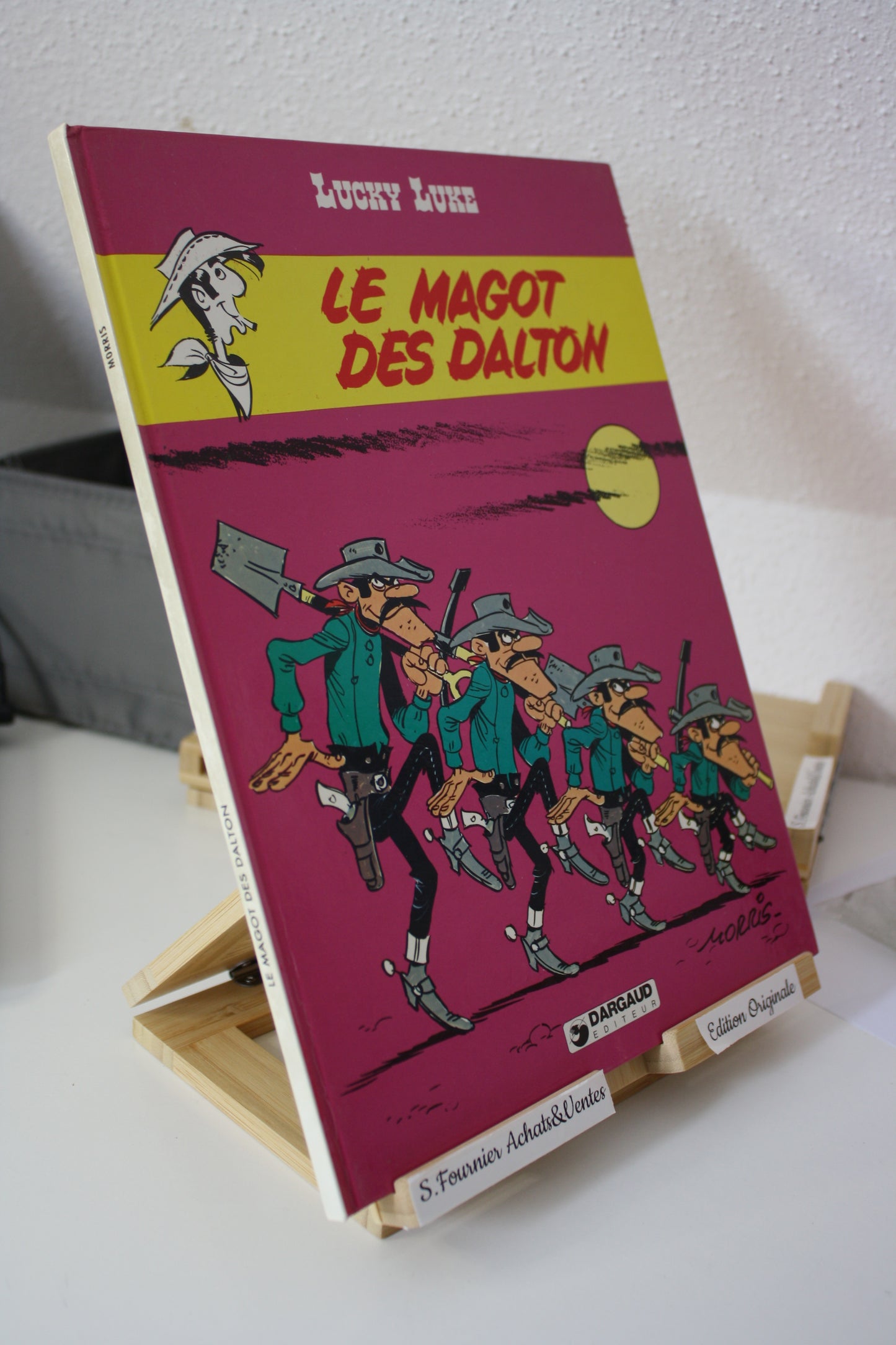 Le magot des Dalton – Lucky Luke – Morris - Dargaud Editeur - EO – 1987 - Abimé