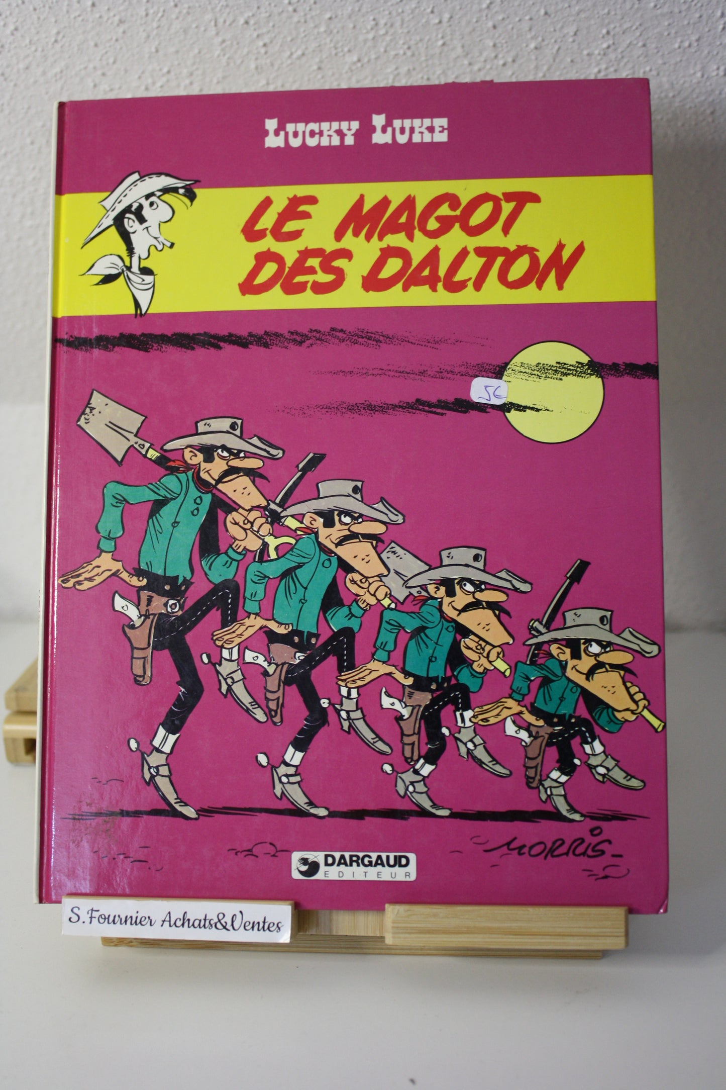 Le magot des Dalton – Lucky Luke – Morris - Dargaud Editeur - EO – 1987 - Abimé