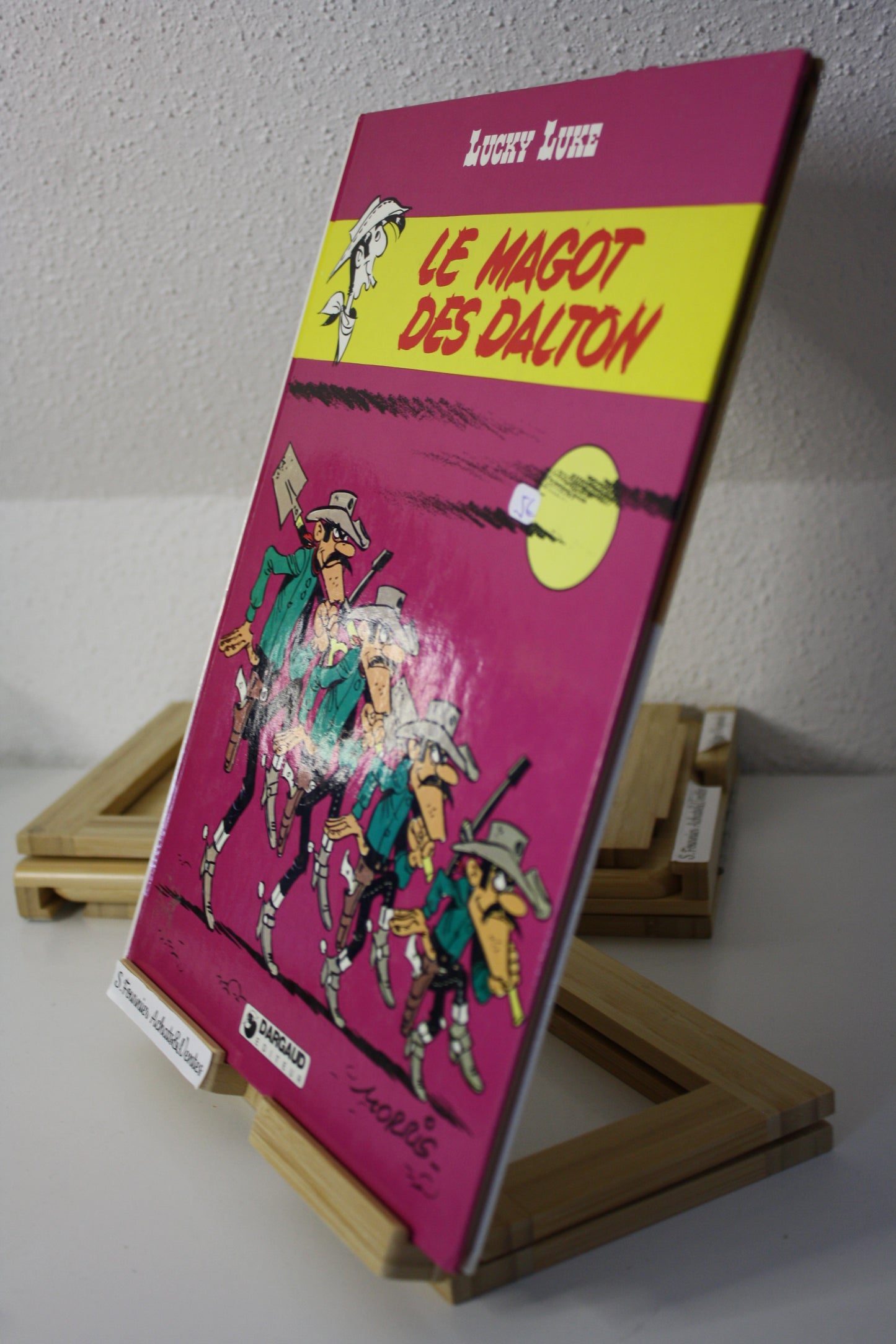 Le magot des Dalton – Lucky Luke – Morris - Dargaud Editeur - EO – 1987 - Abimé