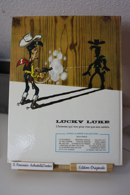 Le magot des Dalton – Lucky Luke – Morris - Dargaud Editeur - EO – 1987 - Abimé