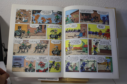 Le magot des Dalton – Lucky Luke – Morris - Dargaud Editeur - EO – 1987 - Abimé