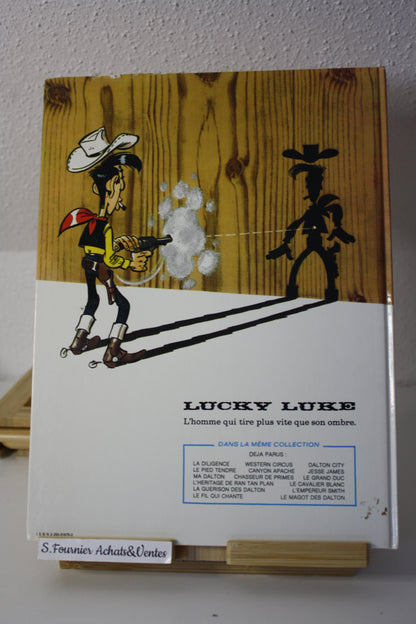 Le magot des Dalton – Lucky Luke – Morris - Dargaud Editeur - EO – 1987 - Abimé